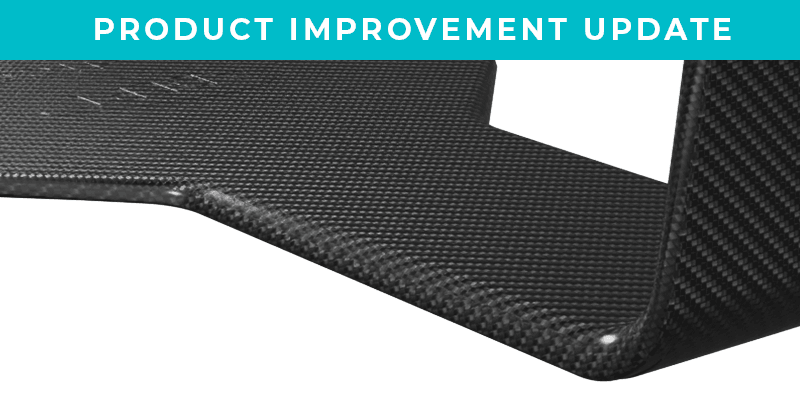 A "PRODUCT IMPROVEMENT UPDATE" banner above an L-shaped piece of dark carbon fiber.